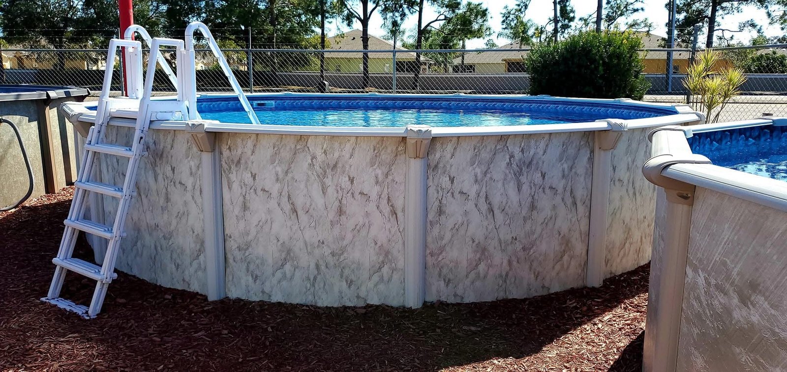 Above Ground Swimming Pools At Mr. Pool of Pasco & Crystal River 9 An above ground pool in a customer's backyard at Mr. Pool Hudson location
